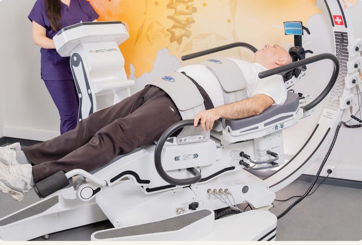 A patient lying on the RoboSpine spinal decompression system
